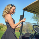 Golfer using Wingman View Remote with speaker on cart bar
