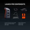 The components of a "LAUNCH PRO" golf monitor kit: the gray and orange monitor, power adapter, cables, alignment sticks, and a club marker pack.
