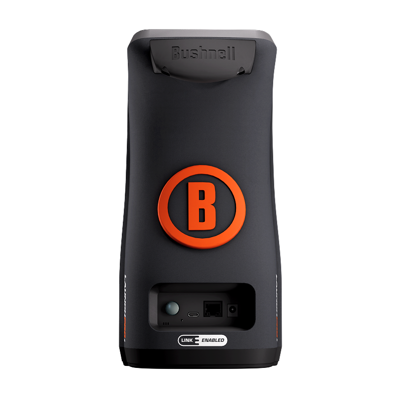 Rear view of Bushnell Golf Launch Pro i featuring bold orange ���B��� logo and connectivity ports for data and power.